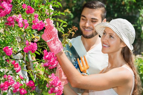 Safety-focused gardener reviewing site hazards before task completion